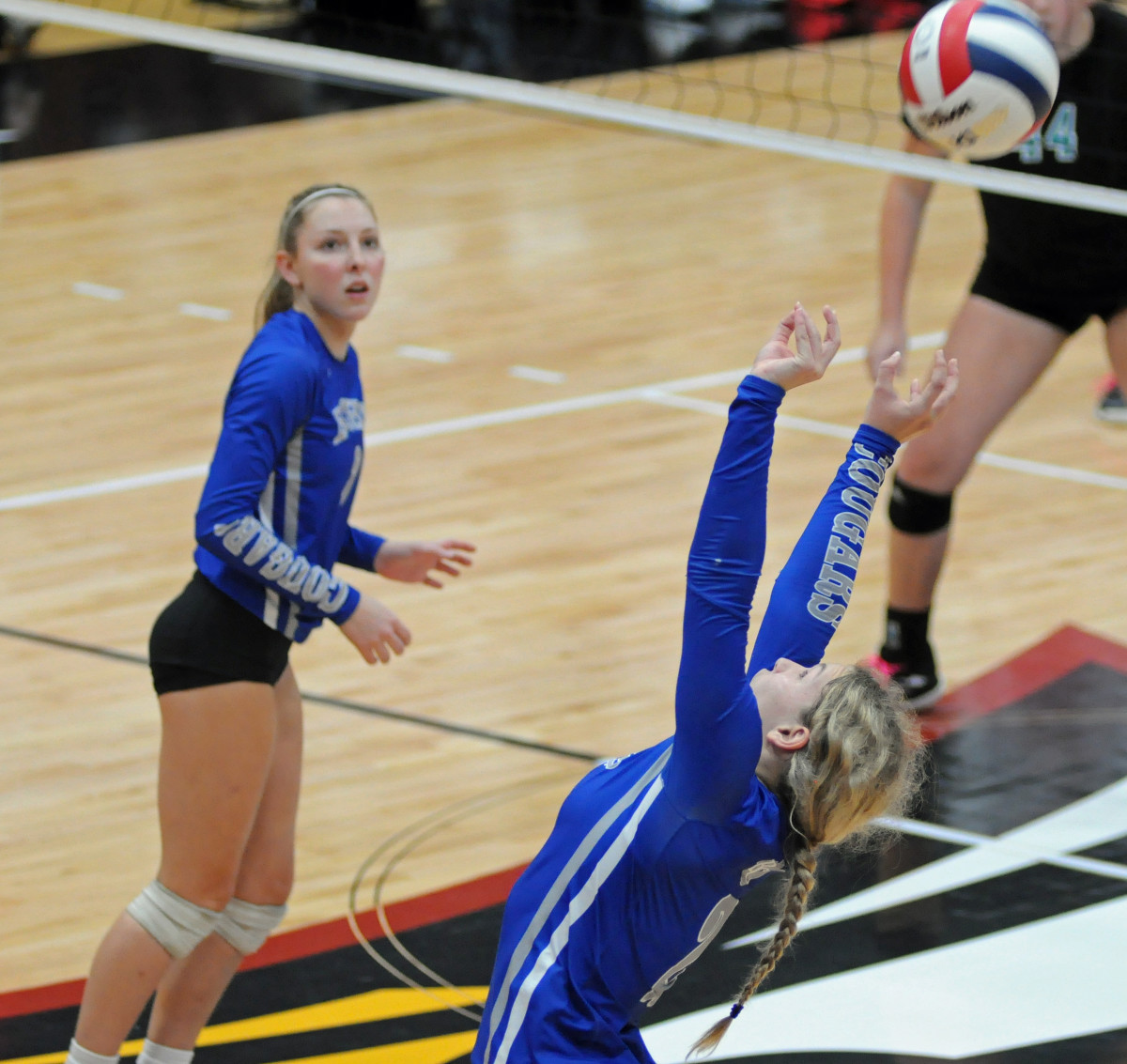 Barron Collier setter Ava Zehnder sets to another Cougars hitter as teammate Kendra Pruitt plays decoy on the play. Zehndeer had 27 assists, and Pruitt had 14 kills against Jensen Beach.